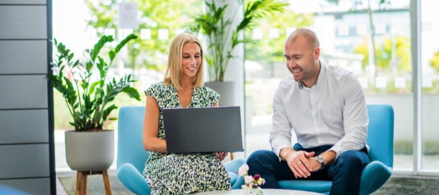 Two people discussing Recruitment Process Outsourcing (RPO)