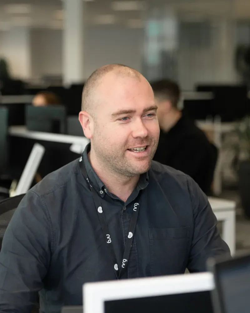 Recruitment consultant at desk smiling